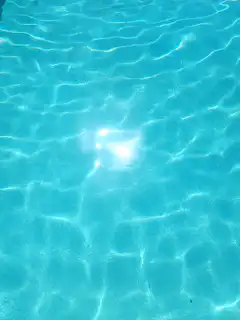 Sunlight on rippling blue water