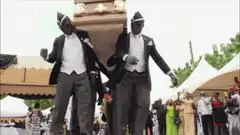 Pallbearers dancing with coffin