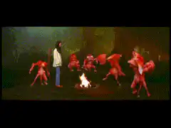Red demons dancing around a fire