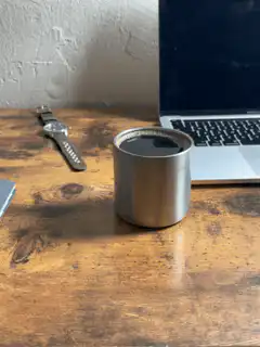 Coffee cup on wooden desk