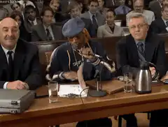 Snoop Dogg holds up FiF sign in court