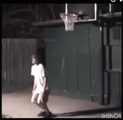 man jumps over kid dunking basketball