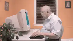Old man confused by computer