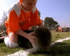 boy in orange jersey headbutts friend