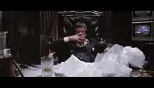 Tony Montana surrounded by cocaine