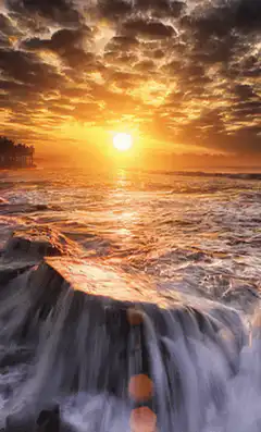 sunset over ocean waves