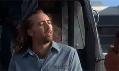 Nicolas Cage Smirking in Prison