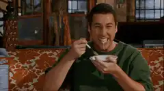 Adam Sandler eating cereal with milk on his face