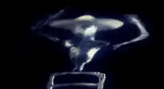 Ghostly figure with hands on head