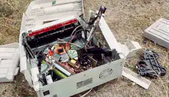 man smashing computer with bat