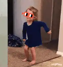 Toddler dancing with sunglasses