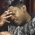 man smoking with eyes closed