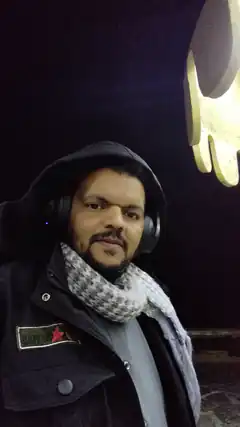 Man in hooded jacket with headphones
