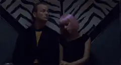 Woman with pink hair falls asleep on man