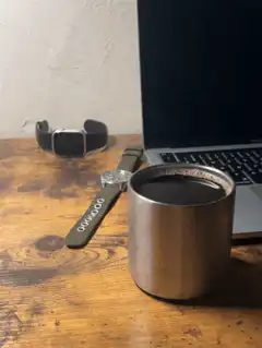 coffee cup and watches on desk