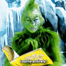 The Grinch reading a book