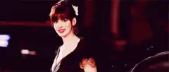 Anne Hathaway winking and turning
