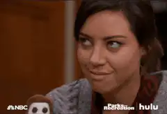 Aubrey Plaza smirking