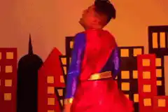 Man in Superman costume dancing