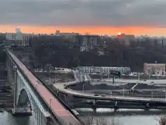sunset over city bridge