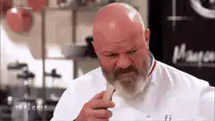 Chef bites into a cracker