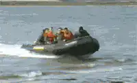 Inflatable boat flips over with people