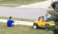 Kid in toy jeep runs over friend