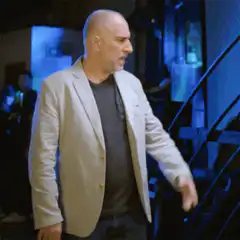 Man facepalms in frustration