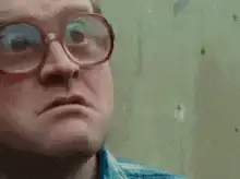 Man with glasses looking confused