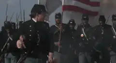 Union officer rallying troops with sword