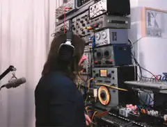 musician turns around in studio