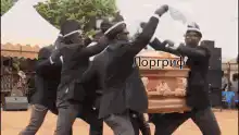 Ghanaian pallbearers dancing with coffin