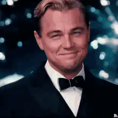 Leonardo DiCaprio toasting with a smile