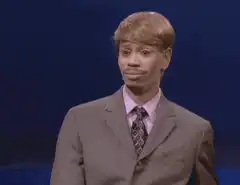 David Spade awkward smile and shrug