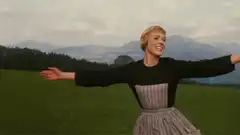 Maria von Trapp singing in the mountains