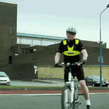 Man on bike zooms past camera