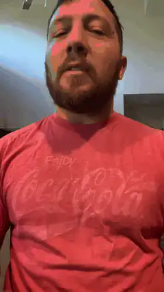 Man in red Coca-Cola shirt with colored lights