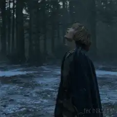 Boy screaming at the sky in the snow