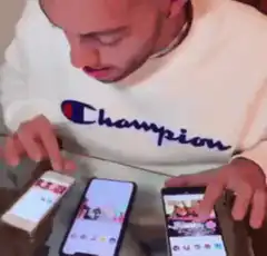 man swiping on three phones