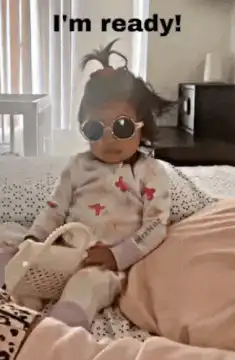 Toddler in sunglasses ready