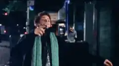 Paul McCartney singing on street