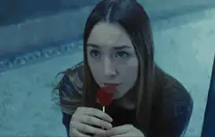 Saoirse Ronan licks lollipop