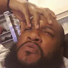 Man rubbing forehead in frustration