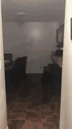 Man in underwear drinking from cup
