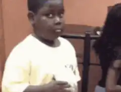 Young boy looking confused