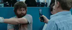 Boy throws flip phone at man