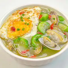 Bowl of egg and clam soup with luffa