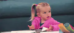 Little girl shrugs with confused expression