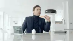Jon Hamm eating a sandwich