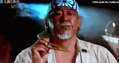 Old man eating with chopsticks